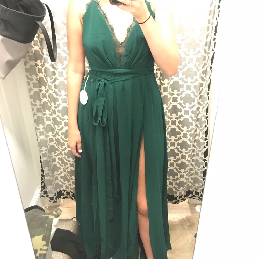 Emerald green gown. Open back with crossing straps